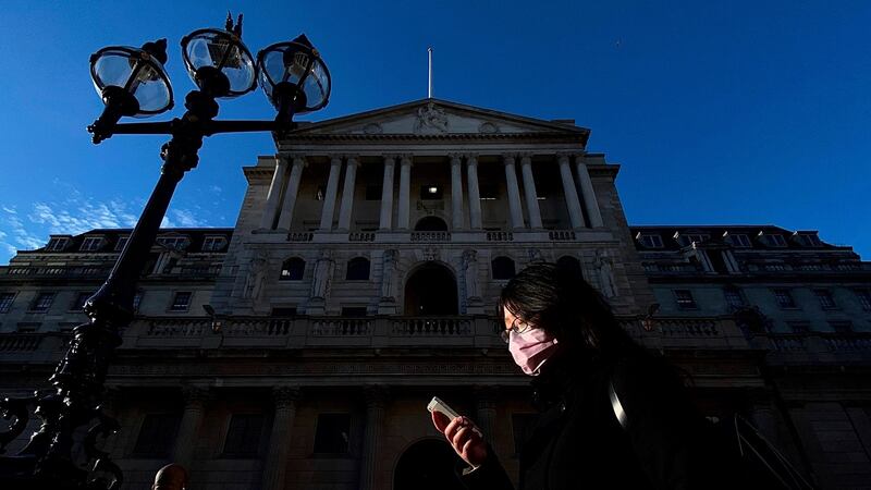 A pedestrian, wearing a protective face mask, walks past the Bank of England in the City of London on March 11th. Photograph: Daniel Leal-Olivas/AFP/Getty Images
