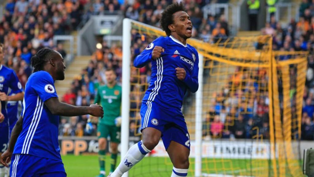 Chelsea’s Willian celebrates after scoring the opening goal in the Premier League football match against Hull City and Chelsea at the KCOM Stadium. Photograph: Lindsey Parnaby/AFP/Getty Images