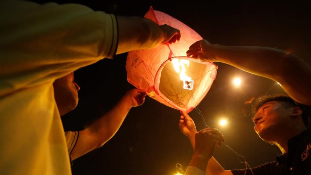 Malaysian ethnic Chinese launch a lantern at a vigil for the passengers of Malaysia Airlines MH370, held near Independence Square in Kuala Lumpur yesterday. Photograph: Edgar Su/Reuters