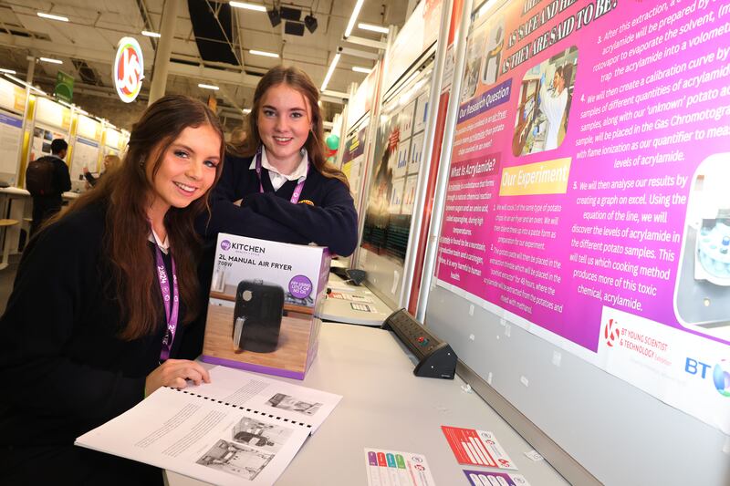 Miriam Finn (left) and Kate McEvoy, St Mary’s High School, Cork, with their project, Are air-fryers really as healthy we think?, at the BT Young Scientist & Technology Exhibition, at the RDS, Ballsbridge, Dublin.
Photograph: Dara Mac Dónaill