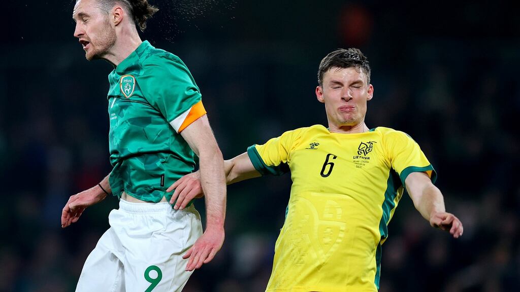 The Republic of Ireland’s Will Keane challenges Lithuania’s Benas Satkus for a header. Photograph: Ryan Byrne/Inpho