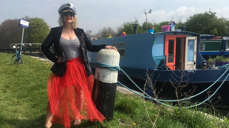 Claire Beck standing next to her boat. Photograph: Claire Beck