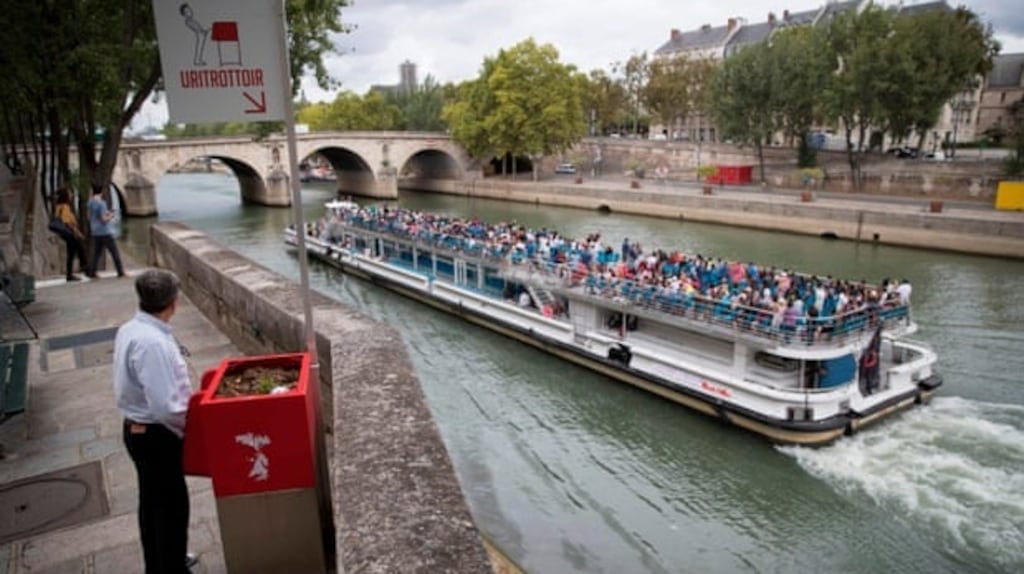 One of Paris’s new open-air street urinals. Photograph: Thomas Samson/AFP/Getty Images