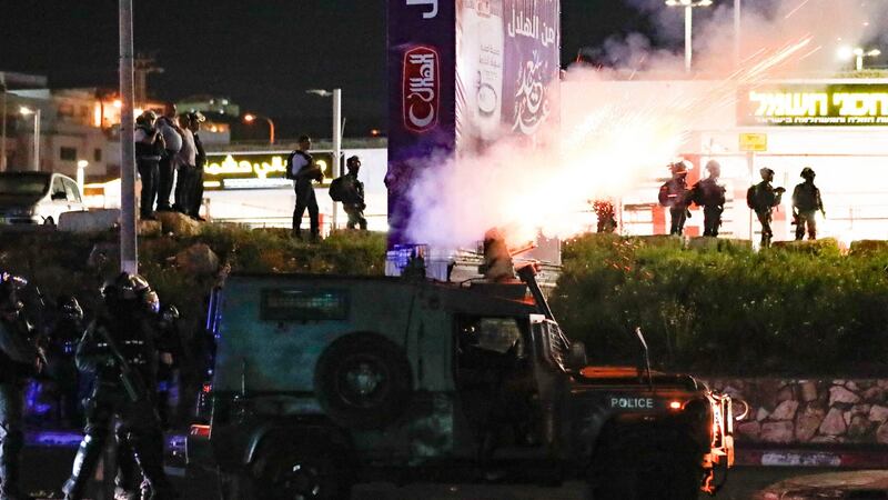 Israeli security forces fire tear gas from an armoured vehicle during confrontations with Palestinian protesters in the mostly Arab city of Umm al-Fahm in northern Israel on Wednesday. Photograph: Ahmad Gharabli/AFP via Getty