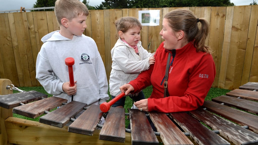 Rhonda Gerrish with her daughter Lauren and son Nathan in the new inclusive playground at the South Beach in Greystones. Photograph: Cyril Byrne