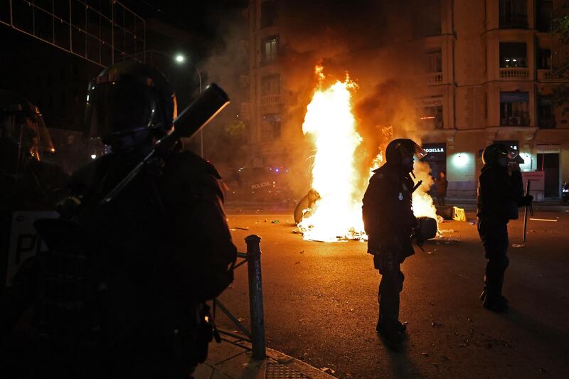 Members of the police stand guard during a protest called by far-right and right-wing movements against government negotiations for granting amnesty to people involved with Catalonia's failed 2017 independence bid. Photograph: Pierre-Philippe Marcou/AFP via Getty Images
