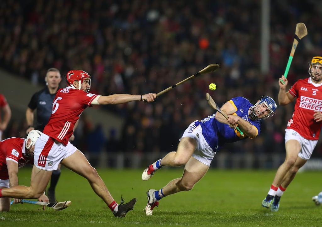 Tipperary's Jason Forde is blocked by Cork's Ciaran Joyce during their Division 1A fixture last month. The counties will meet in the final on April 6th. Photograph: Ken Sutton/Inpho