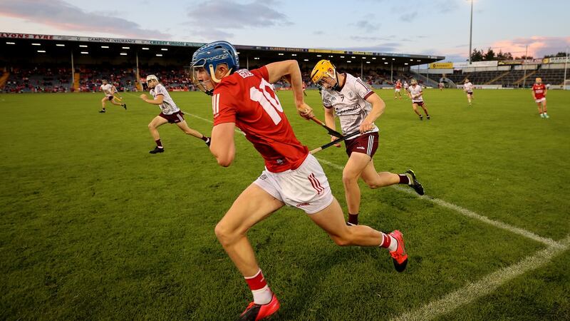 Cork’s Diarmuid Healy bursts clear of Galway’s Nathan Gill during the minor All-Ireland final in Thurles. Photograph: James Crombie/Inpho