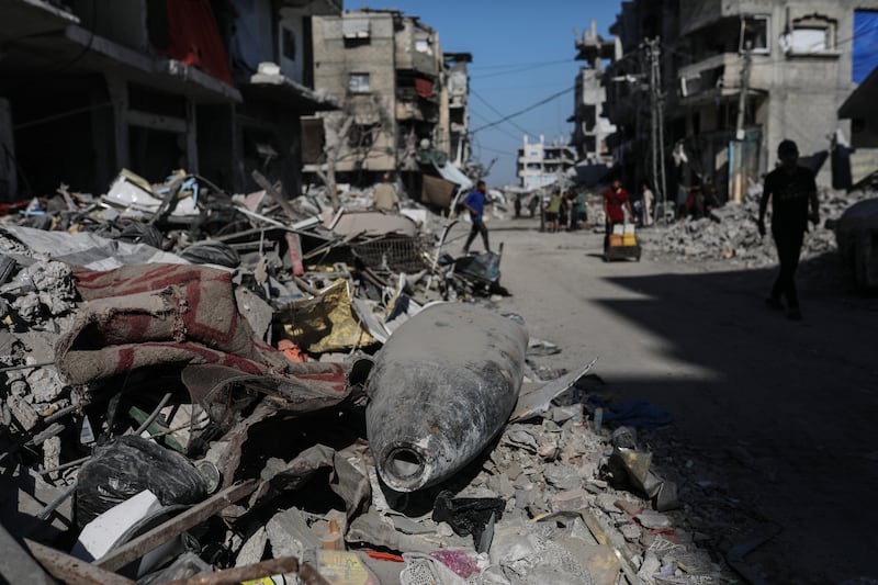An Israeli missile lays on the rubble in the middle of a street next to destroyed houses in Gaza City. Photograph: EPA/Mohammed Saber