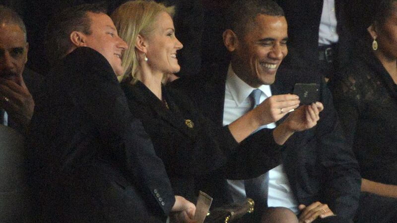 Former US president Barack Obama (R) and former British prime minister David Cameron pose for a selfie picture with Denmark’s former prime minister Helle Thorning Schmidt (C) during the memorial service of South African former president Nelson Mandela. Photograph: Roberto Schmidt/AFP via Getty