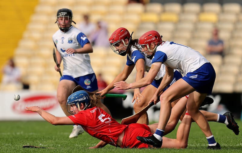 Cork’s Aoife Healy is tackled by Eimear O'Neill with Bevin Bowdren of Waterford. Photograph: INPHO/Bryan Keane