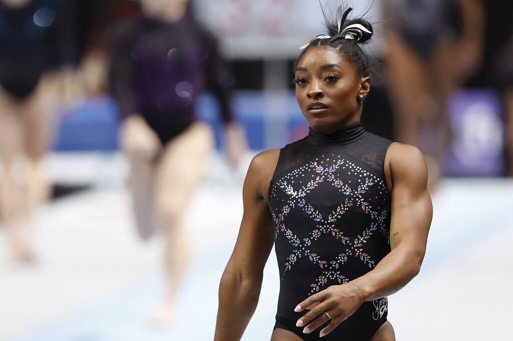 Simone Biles said the video of the girl being apparently passed over during the medal ceremony 'broke my heart'.