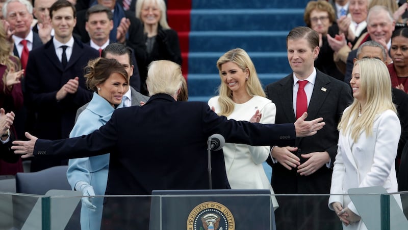 President Donald Trump reaches out to embrace son Barron Trump as First Lady Melania Trump, Ivanka Trump (C), Eric Trump and Tiffany Trump look on after his inauguration on the West Front of the U.S. Capitol in Washington on Friday. Photograph: Alex Wong/Getty Images