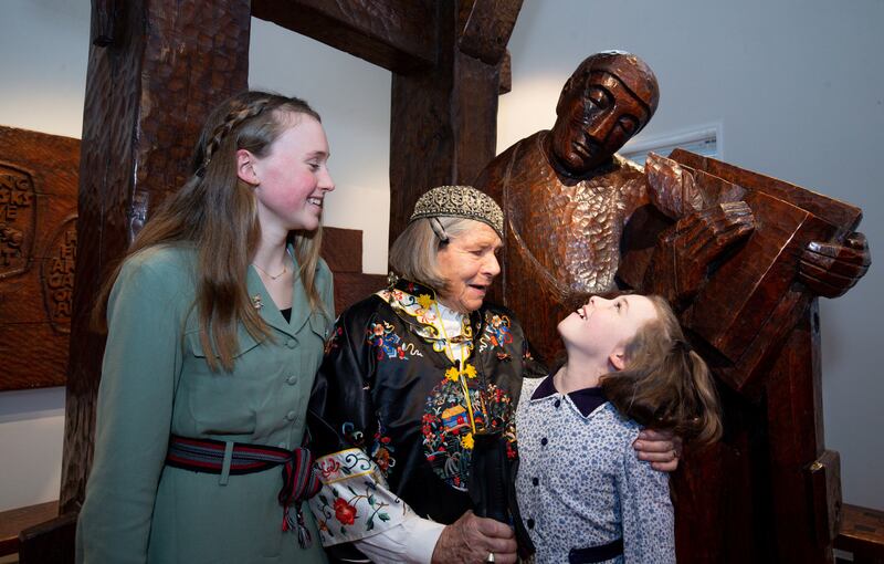Sculptor Imogen Stuart and her great-granddaughters Ramona (13) and Rosaleen Dinneen (10) beside her work Pangur Bán during a reception marking its installation at Áras an Uachtaráin. Photograph: Tom Honan