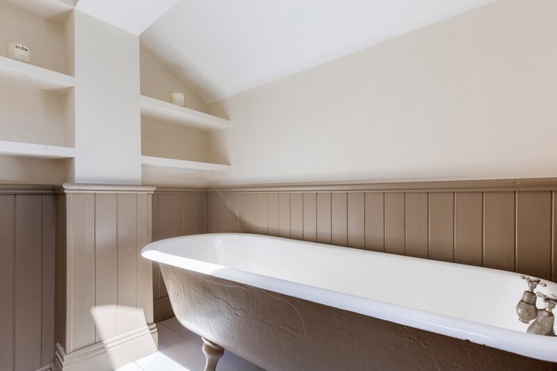 Bathroom with re-enamelled cast-iron bath. Photograph: Viv van der Holst