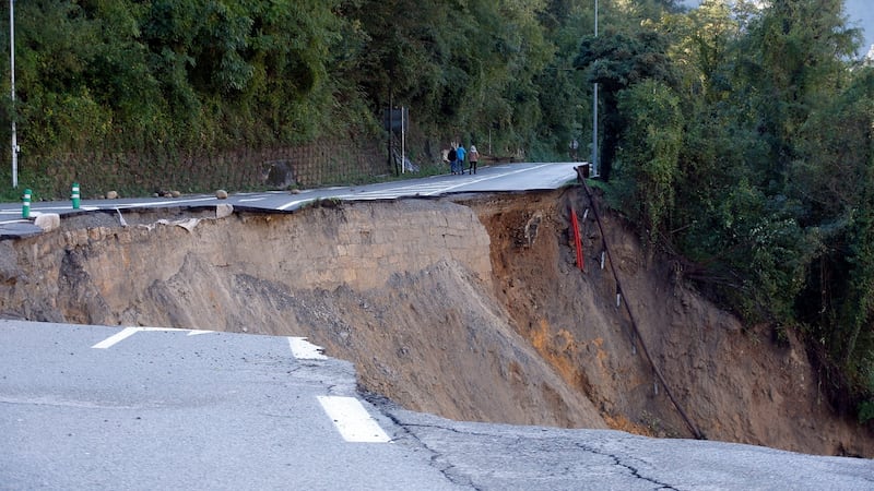 A collapsed road along the Vesubie river that was partially washed away after heavy rain from Storm Alex, in Roquebilliere, France, on Saturday. Continuous heavy rains and further wet weather are expected as storm Alex moves across southern France. Photograph: Sebastien Nogier/EPA