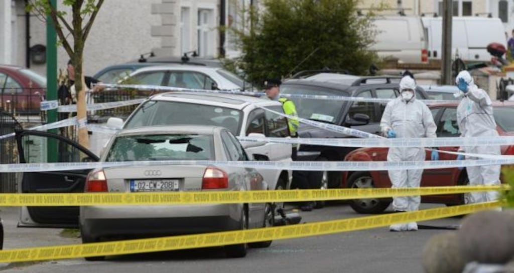 Forensics gardaí examine the scene of the murder of Christopher Zambra at Cooley Road in Drimnagh on Sunday. Photograph: Cyril Byrne