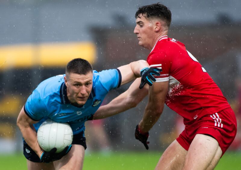 Dublin’s John Small in action against Derry’s Dan Higgins. Photograph: Evan Logan/Inpho