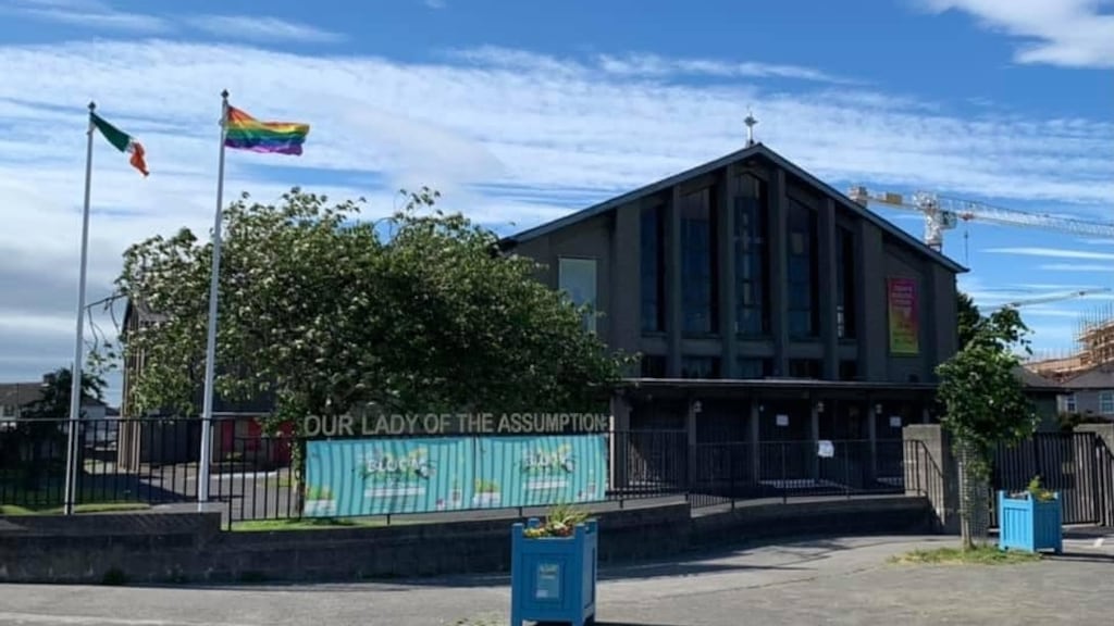 A rainbow Pride flag and a Tricolour flown at the Our Lady of the Assumption parish in Ballyfermot have been removed on the advice of the Dublin Catholic archdiocese. Photograph: Facebook/Ballyfermot Assumption Parish.