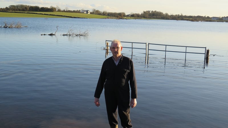 Where there used to be fields, a lake now separates Martin McInerney’s house in Cahermore, Co Galway, from those of his children. Photograph: Jennifer O’Connell/The Irish Times