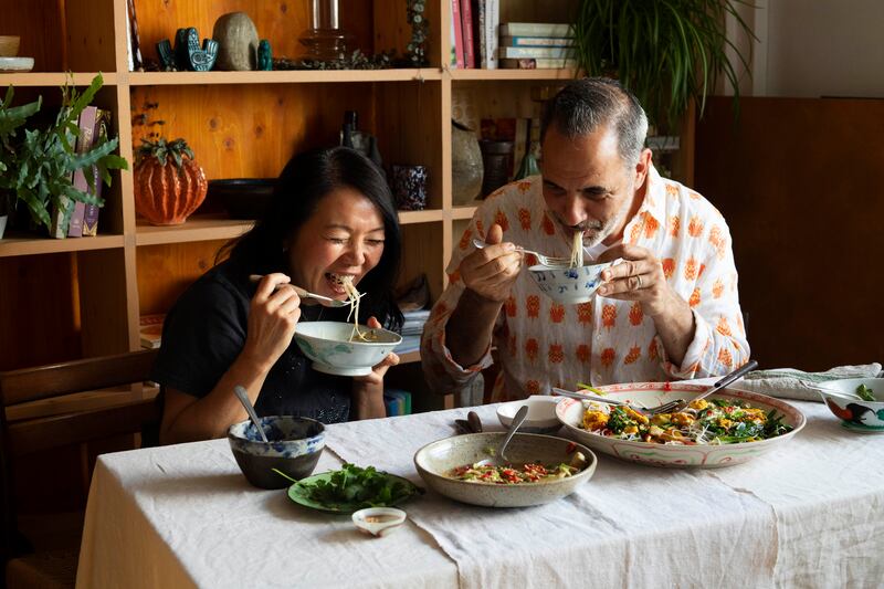 Yotam Ottolenghi and Helen Goh eating steamed aubergine. Photograph: Jonathan Lovekin