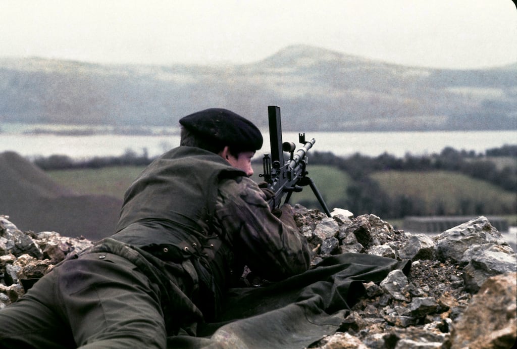 A British soldier patrols Lough Macnean at the junction of the Border that separates Co Fermanagh and Co Cavan, January 1978. Photograph: Alex Bowie/Getty Images