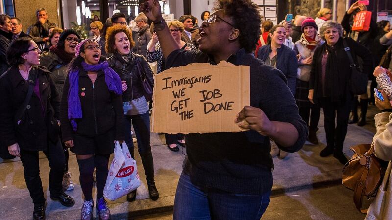 Protesters shout slogans at US vice president-elect Mike Pence as he leaves the Richard Rodgers Theatre in New York on Friday. Photograph: Andres Kudacki/AP
