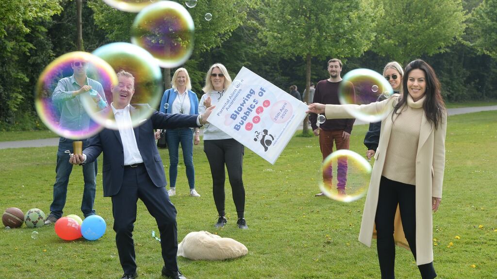 Kenn Joyce, (left) spokesman for Alienated Parents Support  pictured with Jennifer Carroll MacNeill, TD (right) and supporters as Irish Parents marked ‘Bubbles of Love Day’ - International Parental Alienation Awareness Day - in Dublin. Photograph: Dara Mac Dónaill / The Irish Times