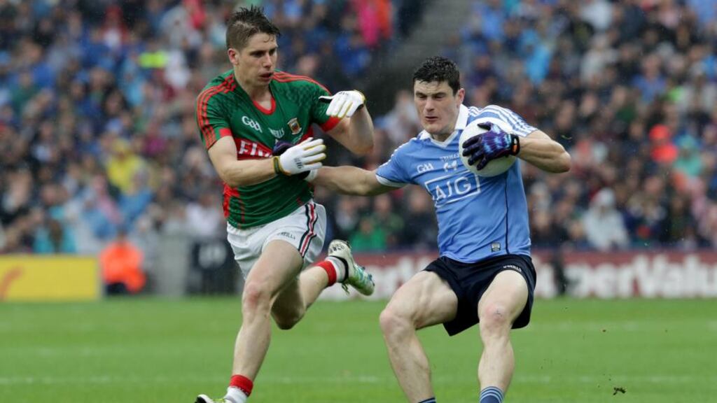 Mayo’s Lee Keegan keeps close to Dublin’s Diarmuid Connolly. Photograph: Inpho