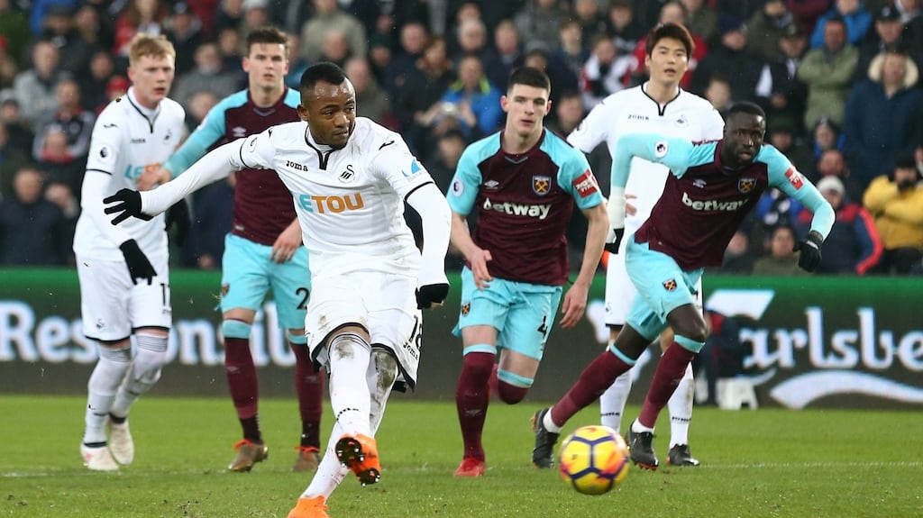 Jordan Ayew of Swansea City scores his side’s fourth goal from the penalty spot during the Premier League match between Swansea City and West Ham United at Liberty Stadium. Photo: Jan Kruger/Getty Images