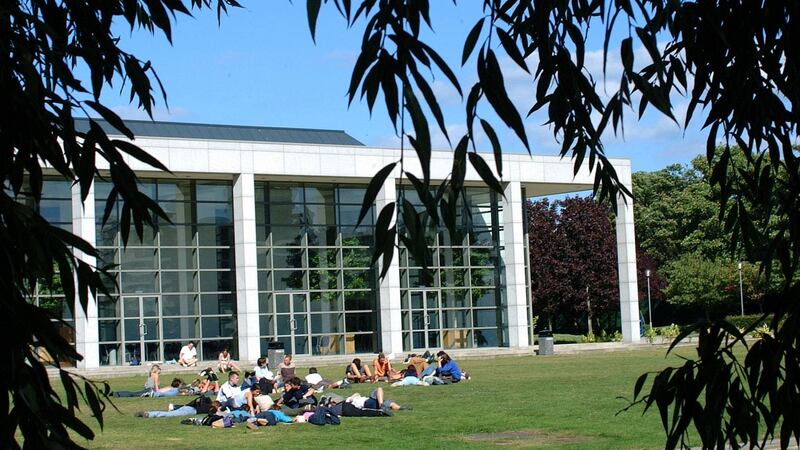 Students beside the lake in UCD, Belfield: UCD will reopen at normal capacity with no limits on numbers in lectures. This means lectures with anything up to 500 students