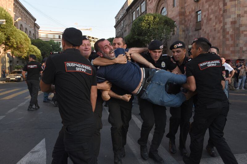 Armenian police officers detain a protester outside a government building in the capital Yerevan on August 8th. Armenian police detained a dozen protesters, mostly war veterans, in central Yerevan after they blocked a government building, demanding authorities take steps to unblock the Lachin corridor. Photograph: Karen Minasyan/AFP via Getty Images
