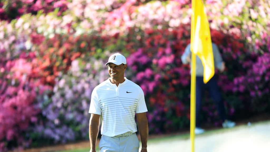 Tiger Woods smiles on the 13th green during a practice round prior to the start of the 2018 Masters Tournament at Augusta National. Photograph: Andrew Redington/Getty Images