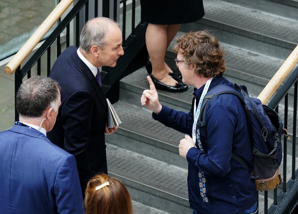 Tanaiste Micheal Martin speaking with Michael Higgins, son of President Michael D. Higgins, at University of Galway as they attended the Consultative Forum on International Security Policy. Picture date: Friday June 23, 2023. See PA story IRISH Security. Photograph: