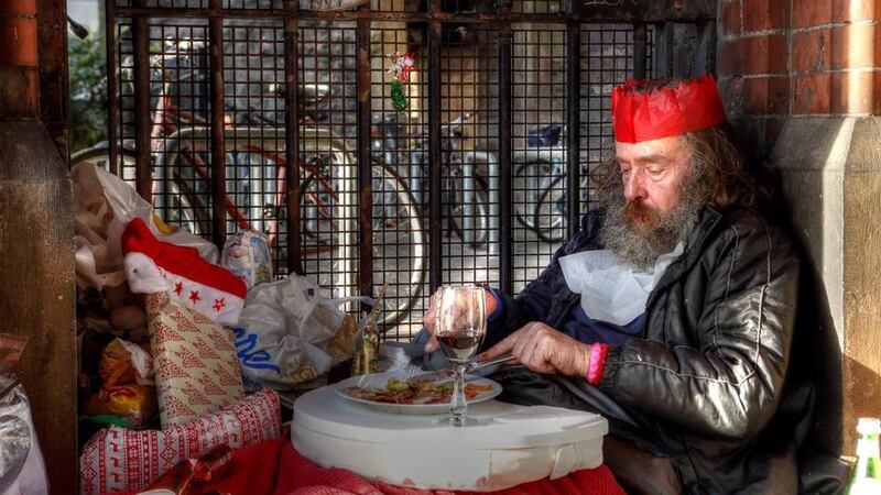 Christmas dinner: the photographer brought Martin Hart Christmas dinner, with a bottle of wine, beneath Westland Row bridge. Photograph: Donal Moloney