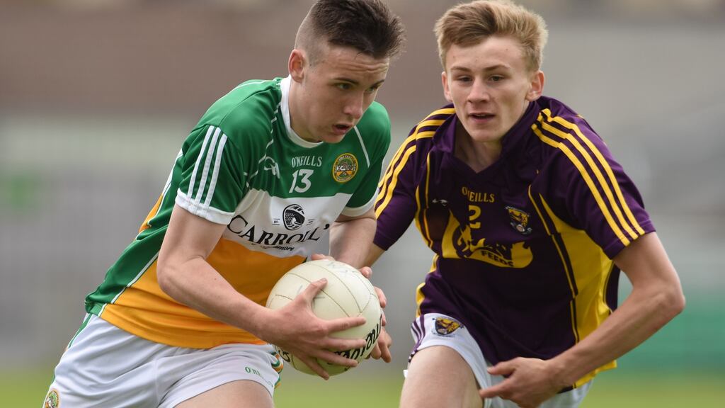 Cian Johnson of Offaly and Wexford’s Martin O’Connor. Johnson  played  O’Byrne Cup and National League for  Offaly seniors  in his Leaving Cert year.  Photograph: Tom Beary/Inpho