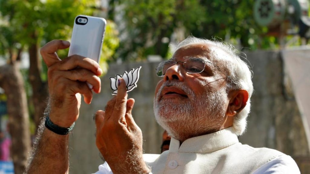 Hindu nationalist Narendra Modi, the prime ministerial candidate for India’s main opposition Bharatiya Janata Party (BJP), takes a “selfie” after casting his vote at a polling station in the western Indian city of Ahmedabad. Photograph: Reuters