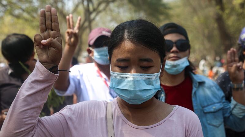People flash a three-finger salute at the funeral of Ma Kyal Sin, a teenage protester shot dead by security forces, in Mandalay on Thursday. Photograph: Kaung Zaw Hein