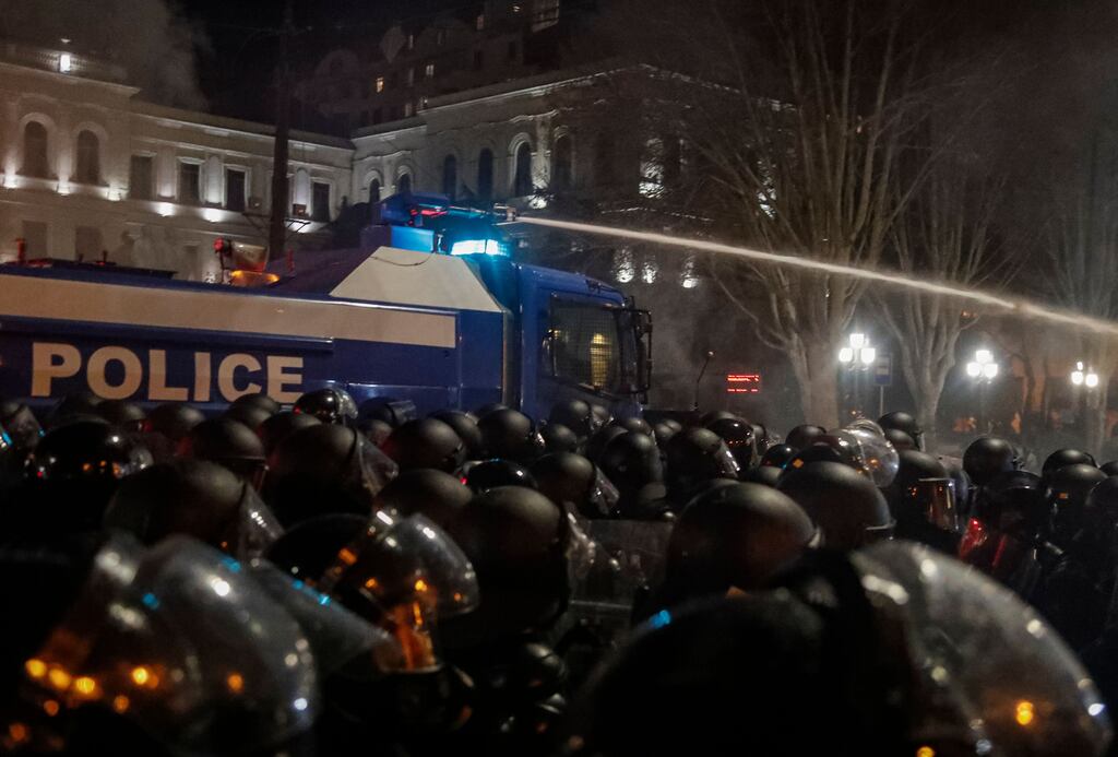 Georgian police uses tear gas and water cannon to disperse protesters as they take part in a rally to protest the first reading of the so-called 'Foreign Agents Law'.  The law says a Georgian legal entity, which is more than 20 per cent funded from abroad, must be considered as an agent of foreign influence and has to register with the Georgian ministry of justice. Photograph: Zurab Kurtsikidze/EPA