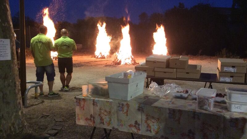 Three large fires, made from old vines, are lit and the cooking begins.
