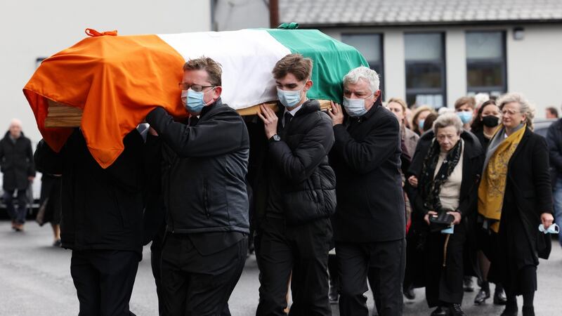 The family of Northern Ireland civil rights activist Austin Curri follow his coffin into the Church of the Immaculate Conception in Allenwood, Co Kildare for his funeral mass. Photograph: Laura Hutton
