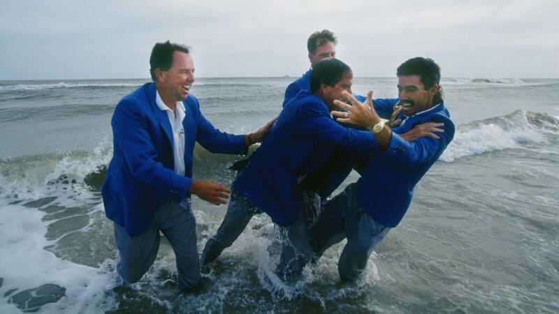 Mark O’’Meara and Payne Stewart look on as team captain Dave Stockton pushes Corey Pavin into the water during US celebrations. Photo: Simon Bruty/Getty Images