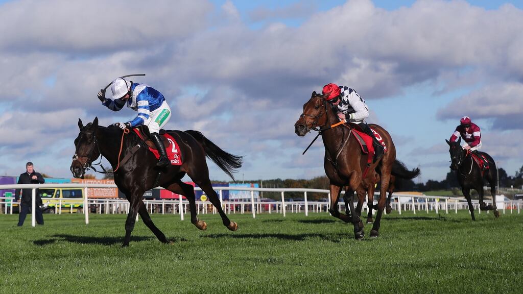Frodon (left) ridden by jockey Bryony Frost on their way to winning the Ladbrokes Champion Chase during day two of the Ladbrokes Festival of Racing at Down Royal. Photo: Niall Carson/PA Wire