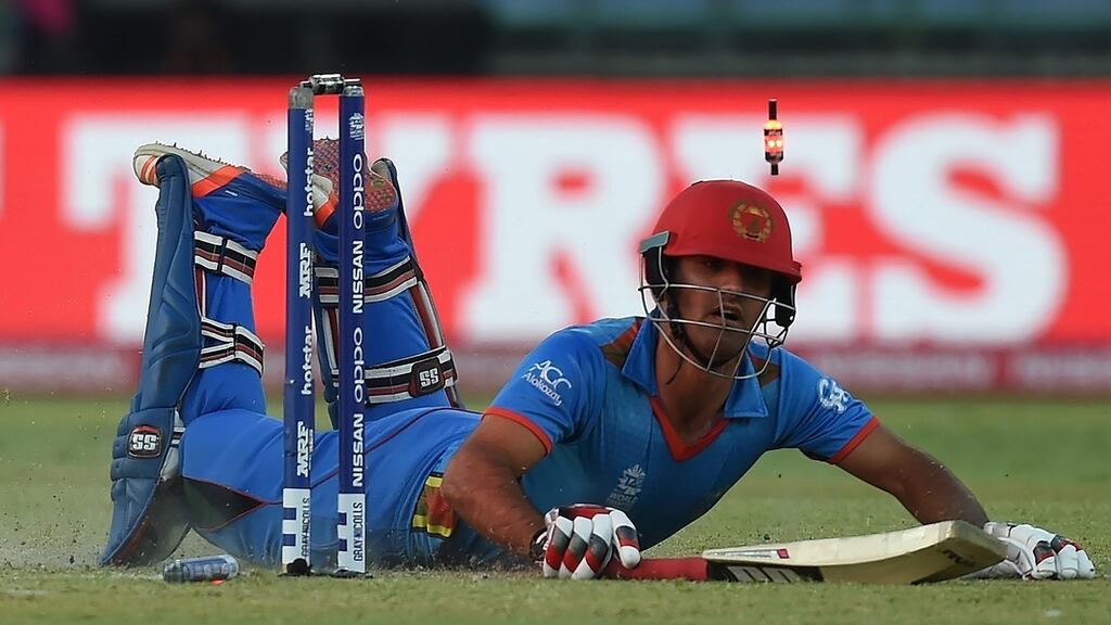 Afghanistan’s Najibullah Zadran makes his ground during his side’s World T20 defeat to England. Photograph: Afp