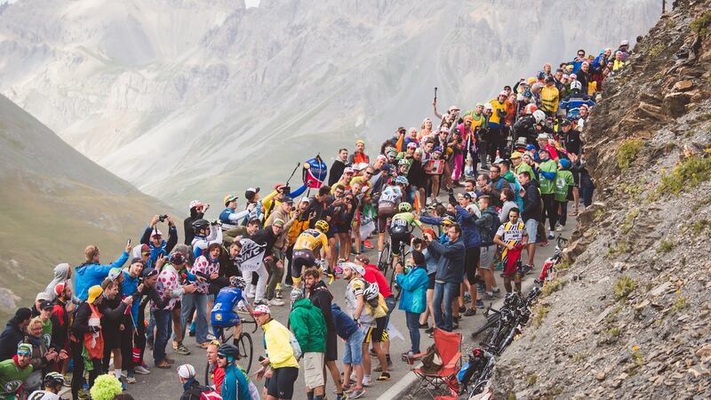 Crowds gather around the yellow jersey group on the Tour de France. File photograph: Simon Gill/Action Plus via Getty Images