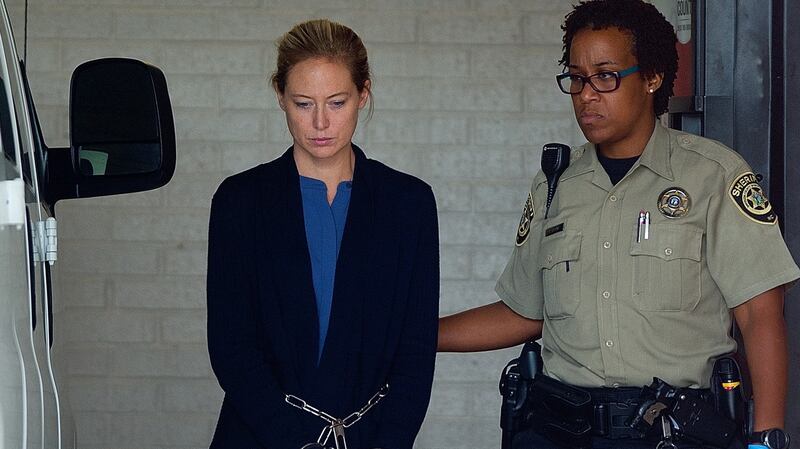 Molly Martens Corbett is led in shackles and handcuffs to a waiting van for transport to prison on Wednesday. Photograph: Donnie Roberts/The Dispatch