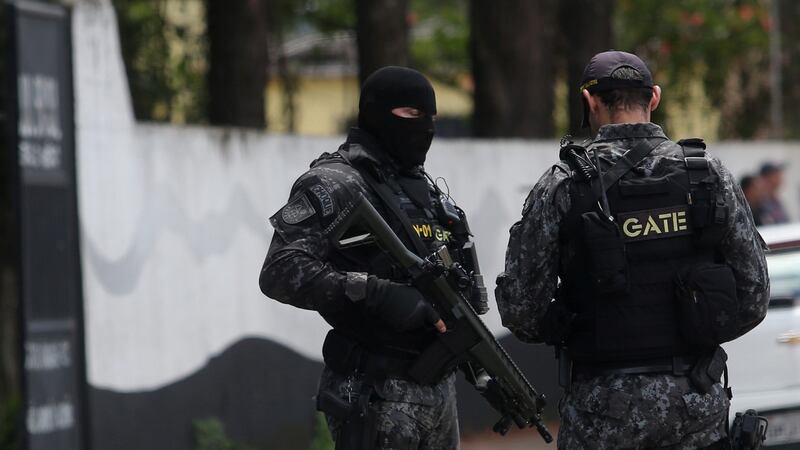 Police outside the Raul Brasil school after a fatal shooting in Suzano, Sao Paulo state, Brazil. Photograph: Amanda Perobelli/Reuters