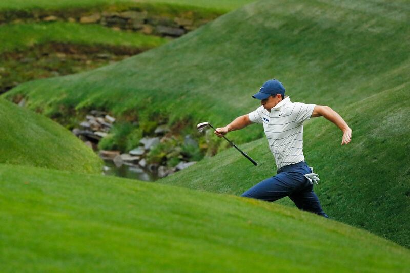 Rory McIlroy at Rae's Creek on the 13th hole. While the par 5s at 13 and 15 are scoring opportunities, McIlroy needs to get as far as them unscathed. Photograph: Kevin C. Cox/Getty Images