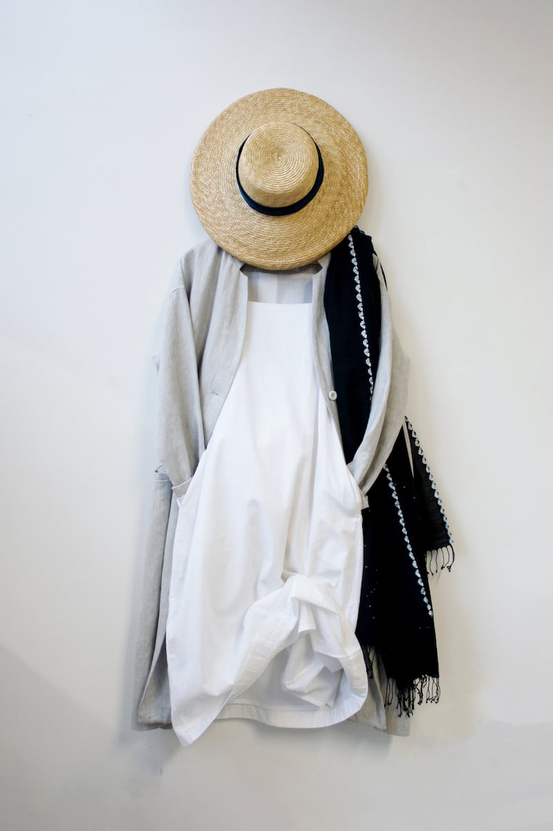 Grey Irish linen coat €560, white slip dress €310, Martell natural straw hat €220.