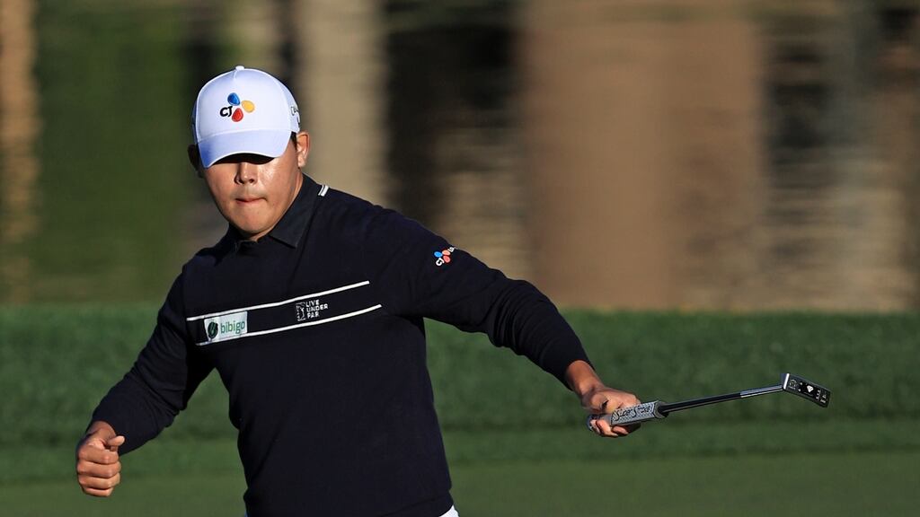 Si Woo Kim of South Korea makes a birdie putt on the 17th hole during the final round of The American Express tournament on the Stadium course at PGA West. Photo: Sean M. Haffey/Getty Images